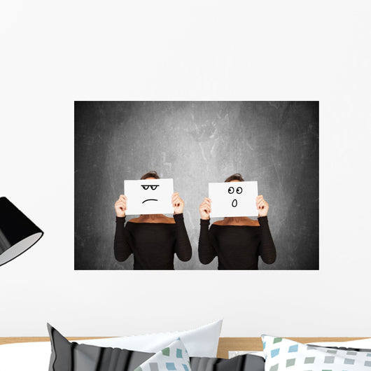 two women hiding behind sheets of paper Wall Mural