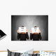 two women hiding behind sheets of paper Wall Mural