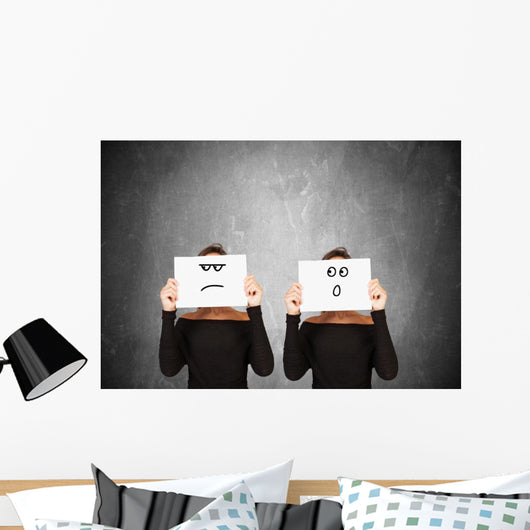 two women hiding behind sheets of paper Wall Mural