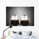 two women hiding behind sheets of paper Wall Mural