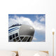 The nose of cargo aircraft, blue sky with white clouds Wall Mural
