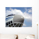 The nose of cargo aircraft, blue sky with white clouds Wall Mural