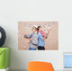 Young couple in a Photo Booth party with gesture face Wall Mural