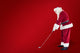 Composite image of santa claus is playing golf Wall Mural
