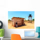 House with water tank in a village in Africa Wall Mural