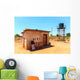 House with water tank in a village in Africa Wall Mural