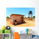 House with water tank in a village in Africa Wall Mural