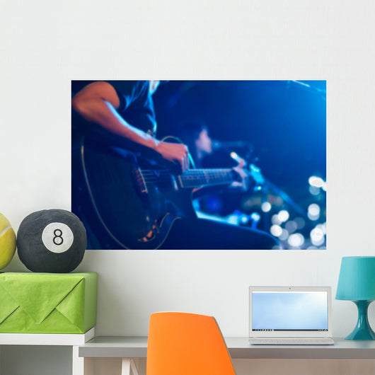 Guitarist on stage for background, soft and blur concept Wall Mural