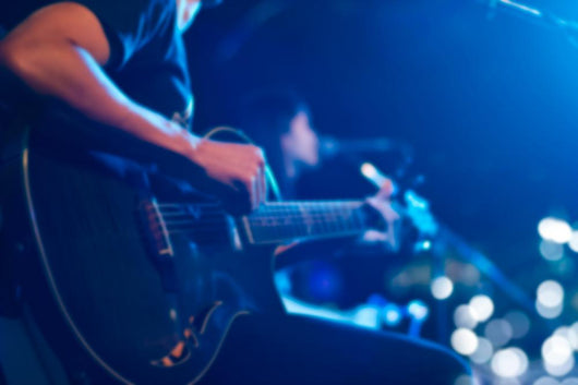 Guitarist on stage for background, soft and blur concept Wall Mural