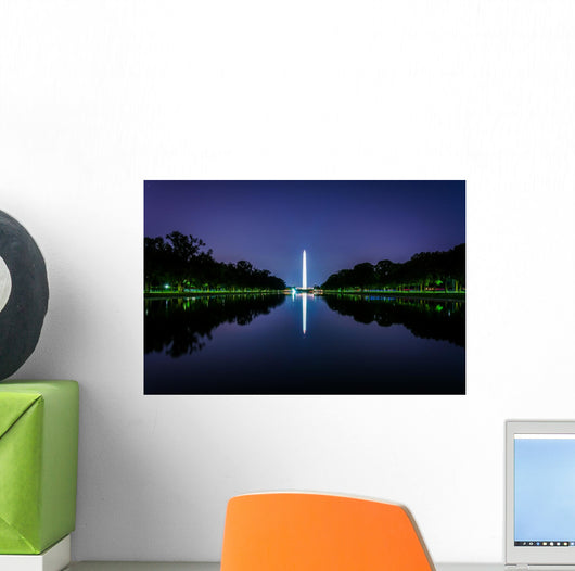 The Washington Monument reflecting in the Reflection Pool at nig Wall Mural
