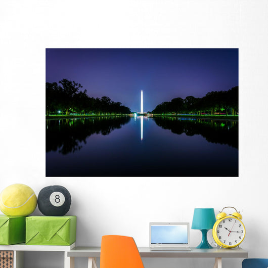 The Washington Monument reflecting in the Reflection Pool at nig Wall Mural
