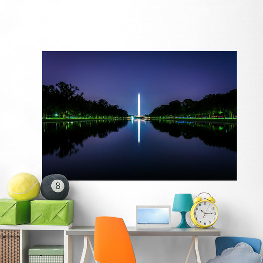 The Washington Monument reflecting in the Reflection Pool at nig Wall Mural