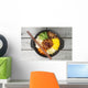 Korean cuisine, beef  Bibimbap in  a clay pot on wooden table Wall Mural