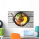Korean cuisine, beef  Bibimbap in  a clay pot on wooden table Wall Mural