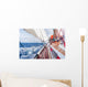 sail boat navigating on the waves Wall Mural