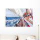 sail boat navigating on the waves Wall Mural