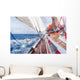 sail boat navigating on the waves Wall Mural