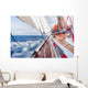 sail boat navigating on the waves Wall Mural