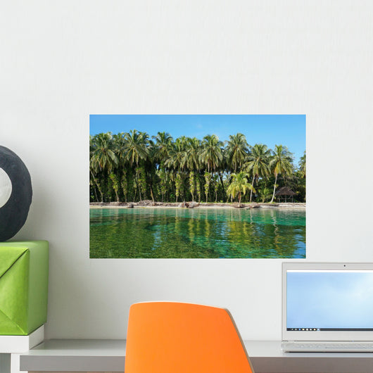 Coconut trees with epiphytes and hut on sea shore Wall Mural