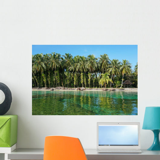 Coconut trees with epiphytes and hut on sea shore Wall Mural