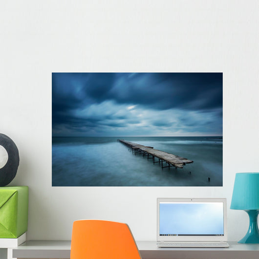 Winter landscape with old broken bridge among the stormy sea Wall Mural
