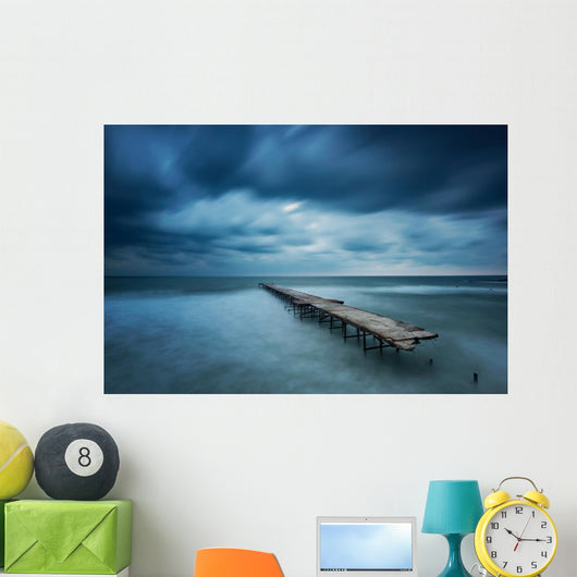 Winter landscape with old broken bridge among the stormy sea Wall Mural