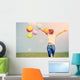 young asian woman on green grassland with colored balloons  Wall Decal