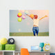 young asian woman on green grassland with colored balloons  Wall Decal