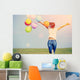 young asian woman on green grassland with colored balloons  Wall Decal