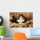 Cute cat lying with book on plaid Wall Decal