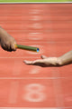  Relay-athletes hands sending action on blur race track  startin Wall Decal
