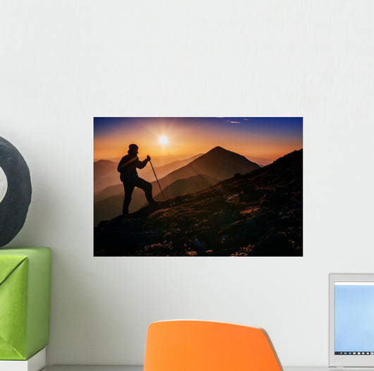 tourist in the mountains at sunset Wall Decal