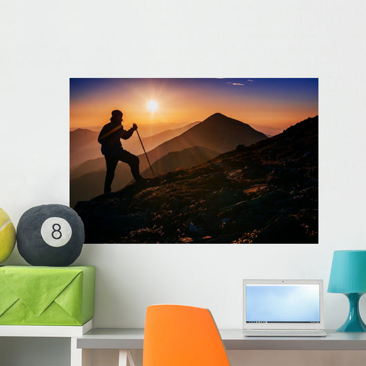 tourist in the mountains at sunset Wall Decal