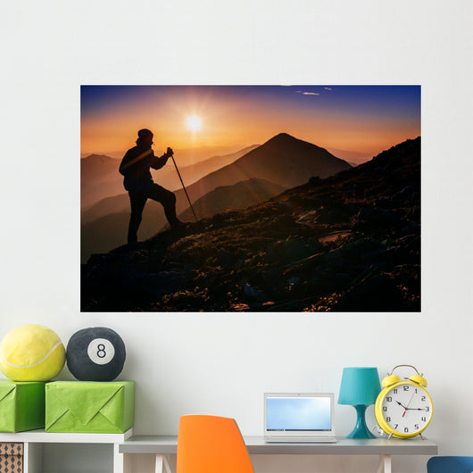 tourist in the mountains at sunset Wall Decal
