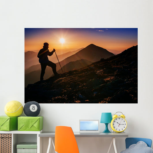 tourist in the mountains at sunset Wall Decal