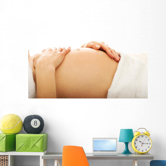 Pregnant woman massagin her belly Wall Decal
