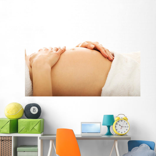 Pregnant woman massagin her belly Wall Decal