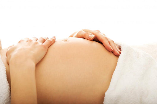 Pregnant woman massagin her belly Wall Decal