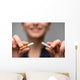 Addiction. Closeup of young attractive woman breaking cigarettes Wall Decal