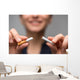 Addiction. Closeup of young attractive woman breaking cigarettes Wall Decal