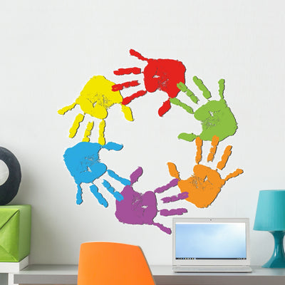 Rainbow Human Hands Wall Decal shown on a wall