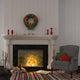 Vintage gray armchair near the fireplace with Christmas decor Wall Decal