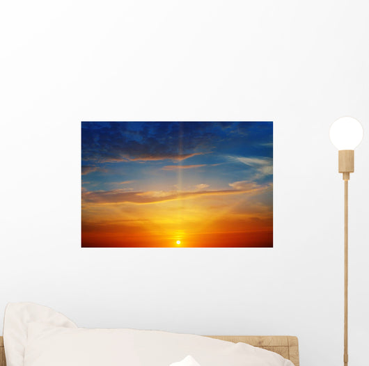 the sun rays illuminate the sky above the horizon Wall Decal