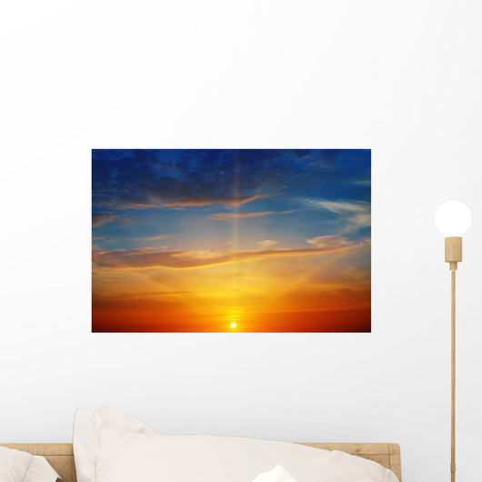the sun rays illuminate the sky above the horizon Wall Decal