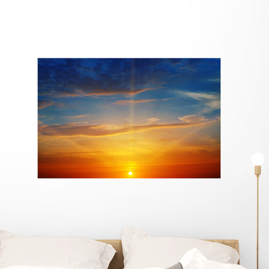 the sun rays illuminate the sky above the horizon Wall Decal