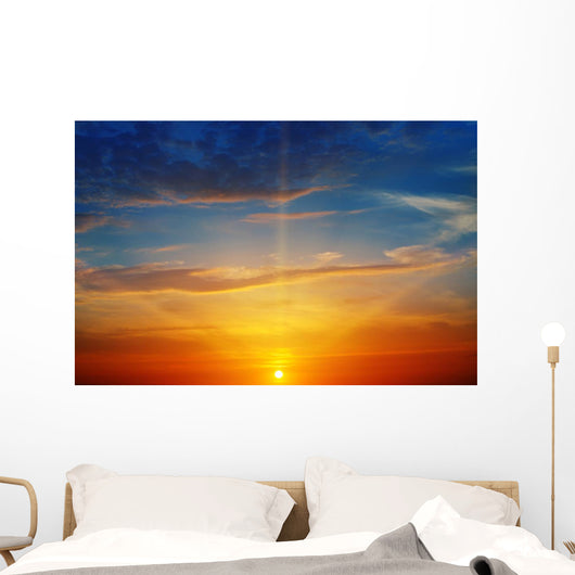 the sun rays illuminate the sky above the horizon Wall Decal