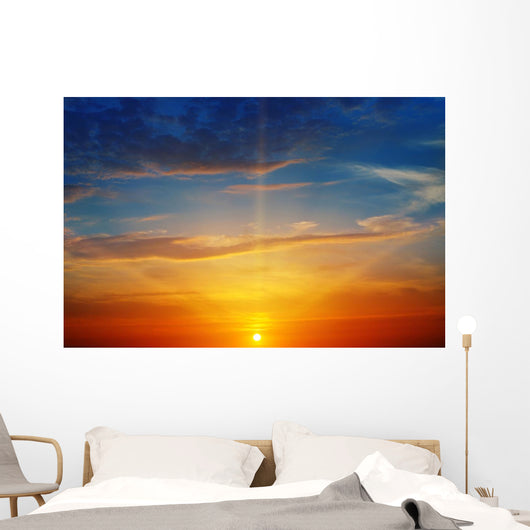 the sun rays illuminate the sky above the horizon Wall Decal