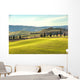 Artistic Tuscan landscape with cypresses, wavy fields and house Wall Decal