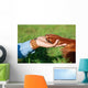 Human Hand Holding Dog's Wall Decal