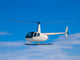 Helicopter flying in the blue sky Wall Decal